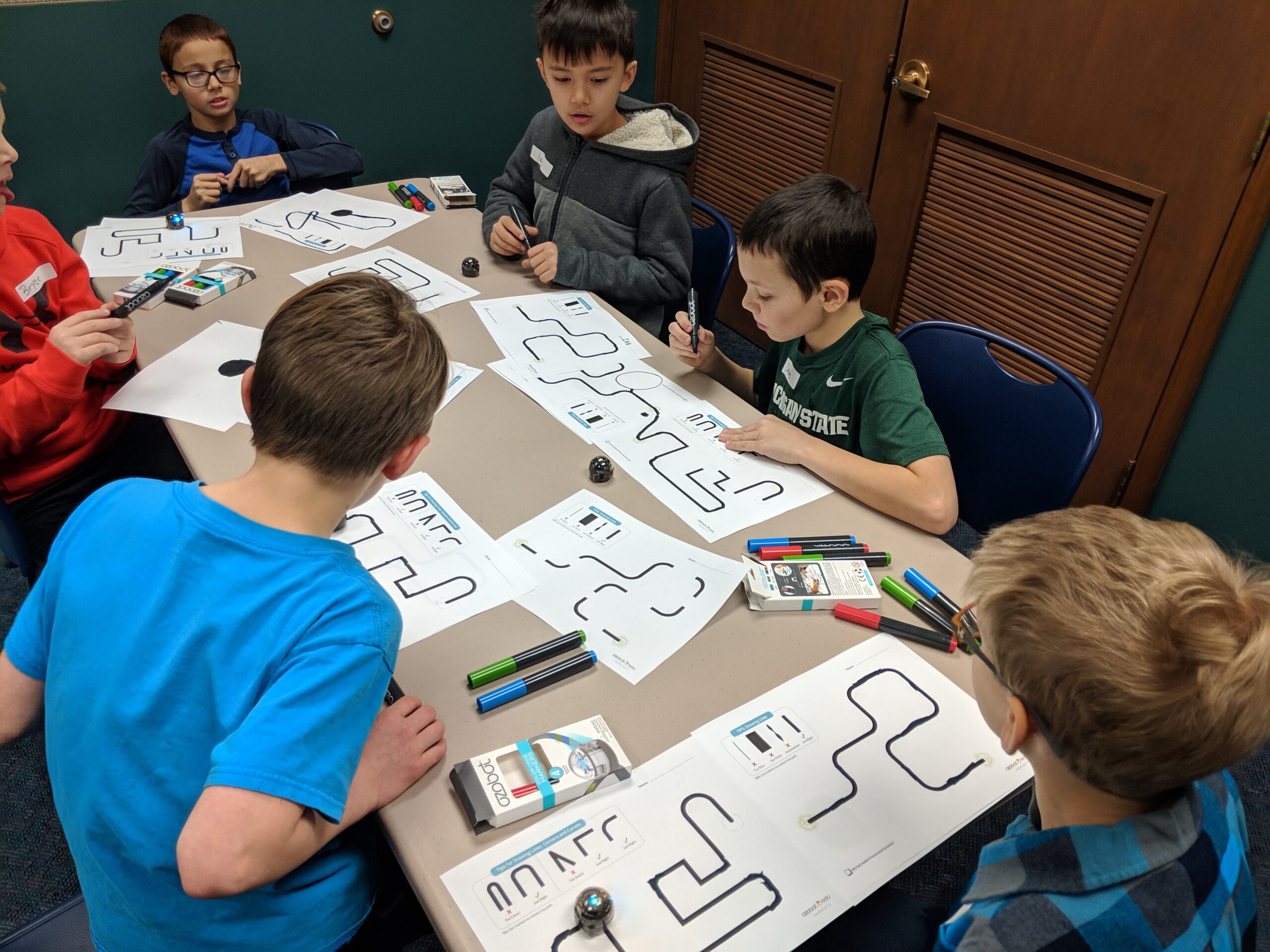 children working on a coding project